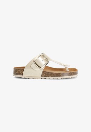 Beige metallinen flip-flop-sandaali, jossa on leveä hihna ja suorakulmainen solki. Korkkipohja ja kumipohja, jossa on teksturoitu pidike.
