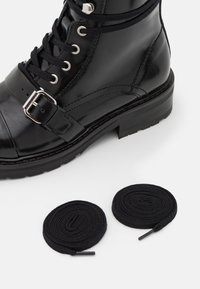 AllSaints Stivaletti stringati - black