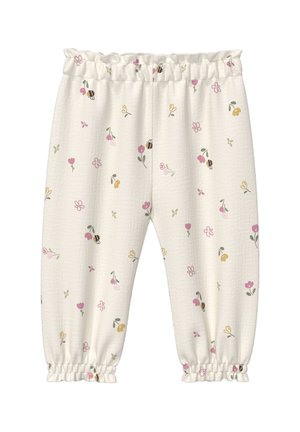 Białe spodnie dla niemowląt z elastycznym pasem i mankietami, ozdobione wzorem małych różowych, żółtych i zielonych kwiatów oraz pszczółek.