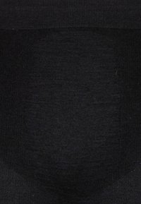 Black knit fabric with a smooth texture, featuring a wide elastic waistband and a seamless design at the center.