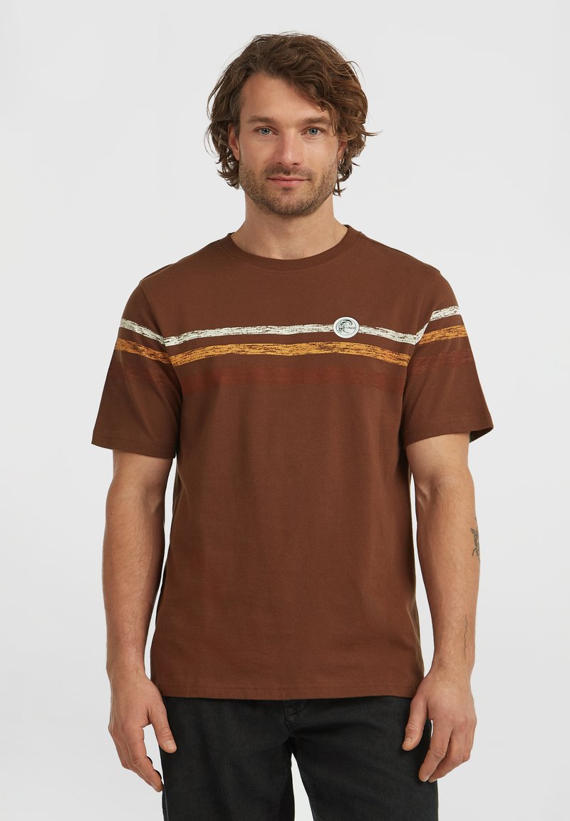 Brown cotton t-shirt with horizontal stripes in white, orange, and brown. Features a round neck and a circular logo patch on the chest.