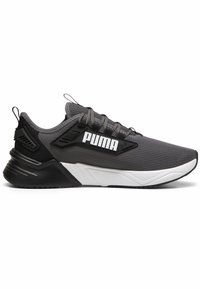 Zapatilla gris con parte superior de malla, acentos negros y suela blanca. Presenta un logotipo distintivo en el lateral y un sistema de cordones texturizado.
