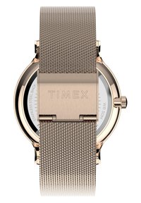 Zegarek z różowego złota na siatce z okrągłą białą tarczą, srebrnymi akcentami i stalowym tyłem, na którym wygrawerowano "TIMEX". Wodoodporny do głębokości 50 m.