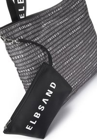 Black tote bag with repeating "ELBSAND" pattern in grey. Includes a detachable black zip pouch with white logo. Durable fabric, structured shape.