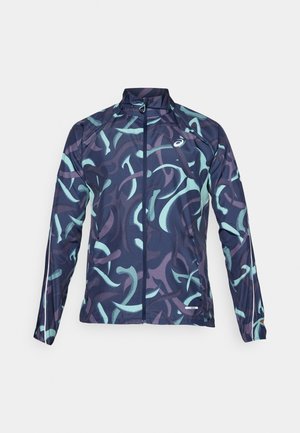 Leichte Jacke mit navyblauem Grund, präsentiert geschwungene Mint- und lila Muster. Enthält einen hohen Kragen und einen Reißverschluss auf der Vorderseite.