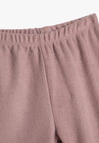 Baumwollhosen in zartem Rosa, mit einer strukturierten Ripp-Oberfläche und einem elastischen Bund für Komfort und Flexibilität.