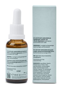 Bottiglia contagocce in vetro marrone con tappo bianco, 30 ml. Scatola azzurra chiara con testo su entrambi i lati, che illustra i benefici del prodotto e le istruzioni per l'uso.