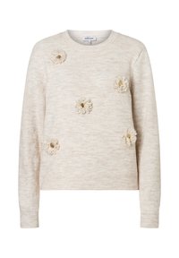 Pull beige tricoté avec des applications florales texturées et des accents dorés sur le devant. Col rond et poignets côtelés. Matière douce.