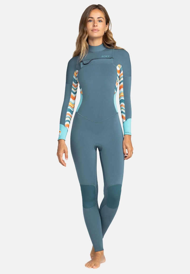 Roxy wetsuit in teal with colorful striped accents on sleeves, smooth texture, fitted design, knee pads, and high-neck collar.
