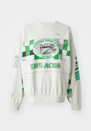 Hvit genser med grønn og grå rutete design, "RITETOWN TENNIS CLUB" merke og teksten "THE ACES" på forsiden. Elastiske mansjetter.