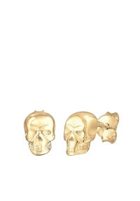 Ciondoli a forma di teschio in oro con dettagli facciali intricati e una finitura lucida. Include un retro a perno per una vestibilità sicura.
