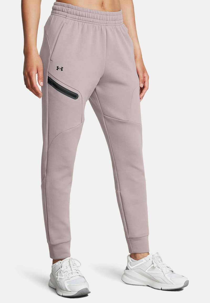 Hellegraue Jogginghose mit schlankem Design, elastischem Bund, schmal zulaufenden Beinen, seitlichem Reißverschlussfach und dezentem Logo-Detail auf der Vorderseite.
