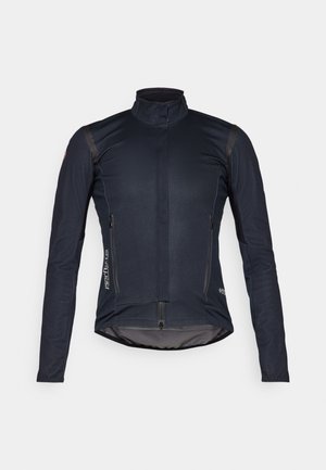 Veste de cyclisme bleu foncé avec manches longues, col haut, fermeture éclair à l'avant et deux poches zippées ; elle présente un tissu lisse et des accents réfléchissants.