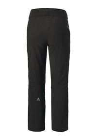 Schwarze Outdoor-Hosen mit einem eleganten Design, weichem Material und dezentem Branding. Mit Reißverschlüssen an den Taschen und schmal zulaufendem Bein.