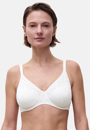 Weiße Spitzen-Bra mit weichen Cups und verstellbaren Trägern. Verfügt über ein glattes Unterband und zarte, strukturierte Spitzenbesätze an der Oberseite.
