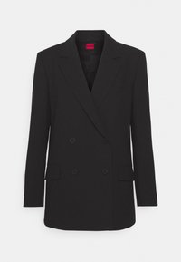 Blazer nero doppiopetto con rever a punta, maniche lunghe, due tasche frontali e finitura opaca. Presenta una chiusura con bottone nascosta.