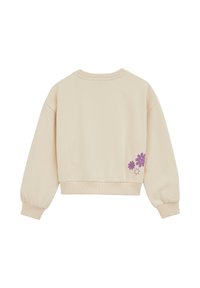 Krátka béžová mikina s rebrovanými manžetami a lemom. Na pravom dolnom boku je fialová kvetová a hviezdičková grafika. Mäkká textúra.