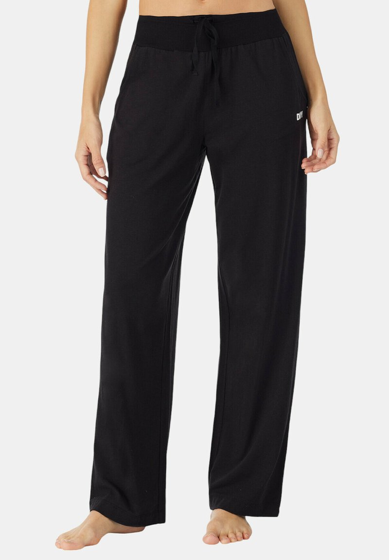 Zwarte, lichte broek met een wijde pijpenontwerp, elastische tailleband en aantrekkoordsluiting. Bevat een klein wit logo aan de linkerzijde.