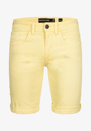 Shorts en denim jaune au design classique, avec des détails usés, des ourlets retroussés et une fermeture à bouton. Étiquette de la marque visible sur la taille.