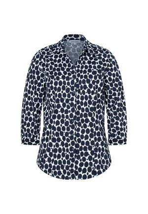 Marineblaue und weiße Hemdbluse mit Dreiviertelärmeln, versehen mit einem Tupfenmuster und einem klassischen Kragen.