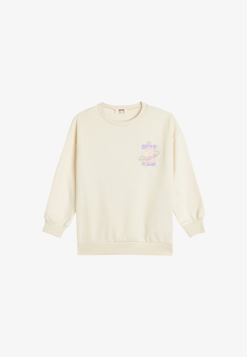 Sweat-shirt crème avec de longues manches bouffantes, des poignets et un ourlet côtelés, arborant un design graphique pastel portant l'inscription "Reine de la Galaxie".