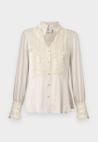 Blusa di raso beige con scollo a V, parte anteriore e polsini decorati con paillettes, maniche lunghe e bottoni dorati. Tessuto liscio, design elegante.