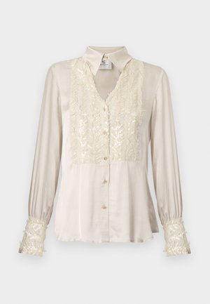 Beżowa satynowa bluzka z dekoltem w serek, ozdobiona cekinowym przodem i mankietami, długimi rękawami oraz złotymi guzikami. Gładka tekstura, elegancki fason.