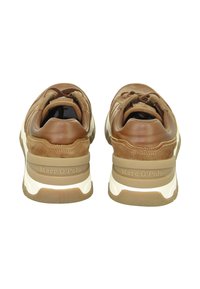 Brown leather and suede sneakers with a cushioned heel and white midsole. Features textured accents and a logo on the back.