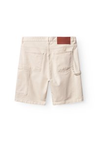 Beige cotton shorts with a straight cut, two back pockets, and a side pocket. Features a brown leather tag at the back waistband.