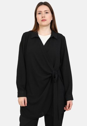 Black wrap shirt with long sleeves, a pointed collar, and a knotted front detail. Made of soft, textured fabric. Lightweight and loose fit.