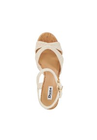 Beige wedge sandal with crisscross textured straps, cork sole, and adjustable ankle buckle. Dune London brand logo visible on the insole.