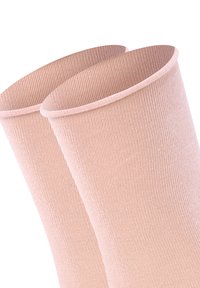 Light pink knee-high socks with a ribbed texture and wide, smooth cuffs. The fabric appears soft and stretchy. No visible patterns or hardware.