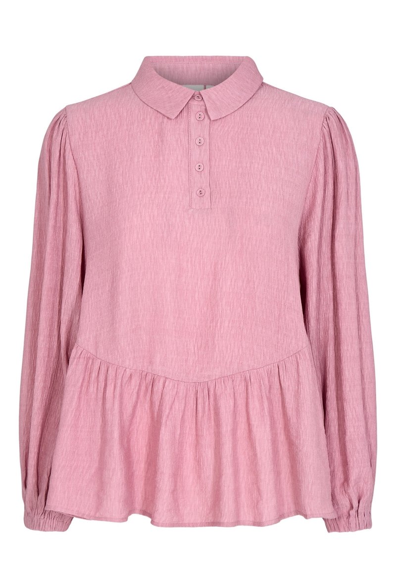 Světle růžová blůza s límečkem, zapínáním na knoflíky vpředu a dlouhými rukávy. Má strukturovanou tkaninu a peplum lem v pase.