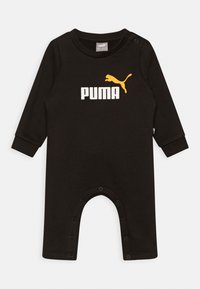 Musta pitkähihaiseen puuvillainen potkupuku, jossa valkoinen "PUMA"-logo ja keltainen puman kuvio. Napit kaulassa ja alaosassa.