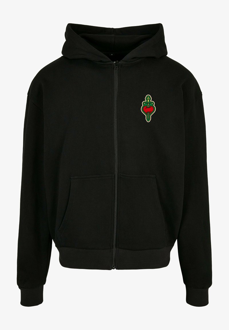 Felpa nera con zip dotata di tasca frontale, polsini a costine e un design a cuore ricamato in verde e rosso sul petto. Tessuto morbido.