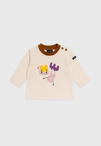 Chemise bébé à manches longues crème avec col marron, deux boutons aux épaules et un graphique coloré de flamant rose sur le devant.