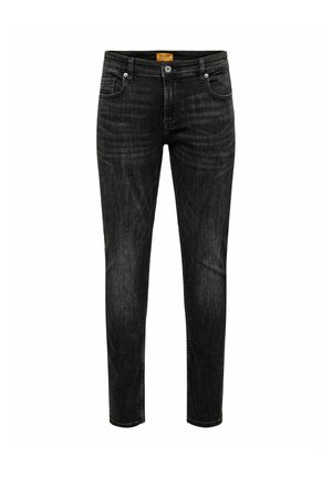 Jean slim noir avec poches avant, fermeture par bouton, passants de ceinture et détails subtilement délavés sur fond blanc.
