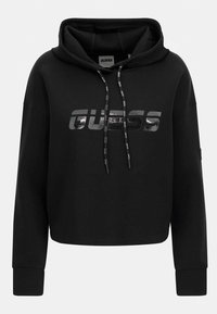 Hoodie noir court en mélange de coton. Comprend un grand logo GUESS métallisé, une capuche avec cordon de serrage et des poignets côtelés. Texture lisse.