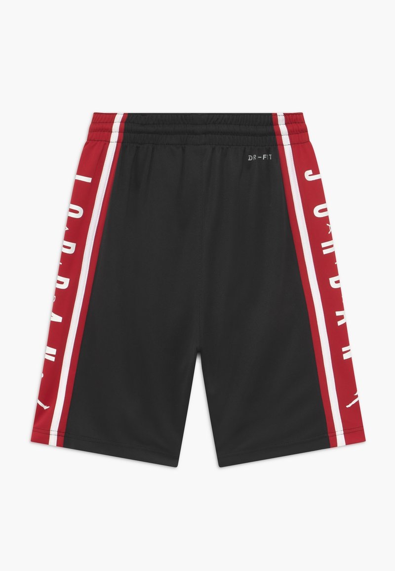 Black athletic shorts featuring red side panels with white stripes and "JORDAN" text. Made from moisture-wicking fabric, elastic waistband.