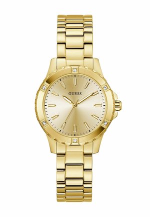 Reloj en tono dorado con una caja redonda, pulsera metálica, esfera texturizada y acentos de cristal en las posiciones de las 12, 3, 6 y 9 en punto.