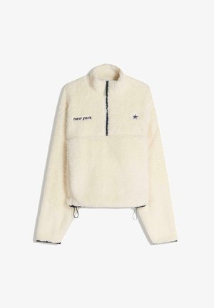 Krémový flísový sveter s polovičným zipsom, vyšívaným nápisom "new york", námorníckymi akcentmi a nastaviteľnou šnúrkou na leme.