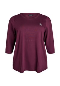 Burgunderfarbenes Langarmshirt mit Rundhalsausschnitt, mit einer subtilen Textur und einem kleinen Logo-Akzent auf der Brust. Lässige Passform.