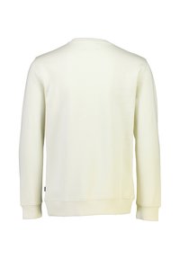 Sudadera color crema con escote redondo, mangas largas, puños de canalé y una textura suave. Diseño minimalista, sin patrones ni acentos.
