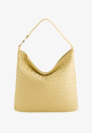 Woven leather shoulder bag in pastel yellow with a curved shape, smooth texture, and an adjustable strap featuring a gold-tone zipper.