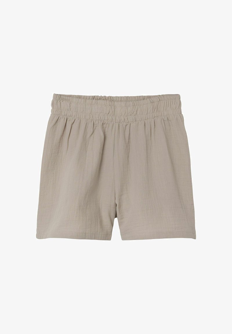 Light beige shorts made of textured fabric, featuring an elastic waistband and loose fit, with a relaxed and casual design.