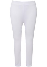 Vita leggings gjorda av elastisk tyg med en slät yta. Sittande design med hög midja som sträcker sig ner till anklarna.