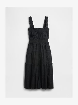 Schwarzes, gestuftes Kleid aus strukturiertem Stoff mit Spitzenakzenten an den Trägern und am Oberteil, mit einer durchgehenden Knopfleiste und gewelltem Saum.