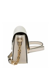 Compact cream leather bag with a structured shape, black accents, gold hardware, and a chain detail on the side strap.
