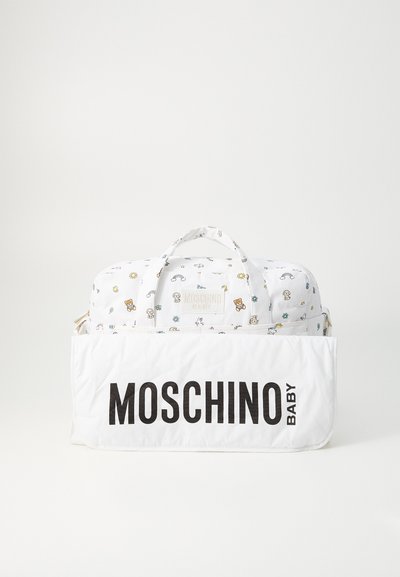 White patterned diaper bag with rainbow and teddy bear designs, featuring dual handles and a front pocket with bold "MOSCHINO BABY" text.