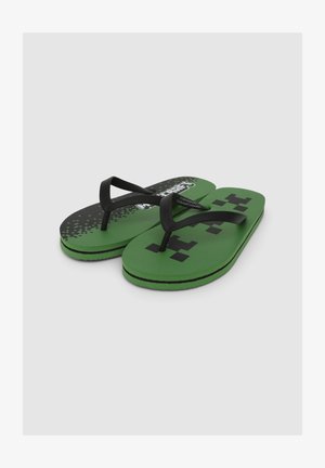 Infradito verdi con cinturini in gomma nera, caratterizzati da un design a motivo con accenti pixelati e la scritta "Minecraft" sulla soletta.